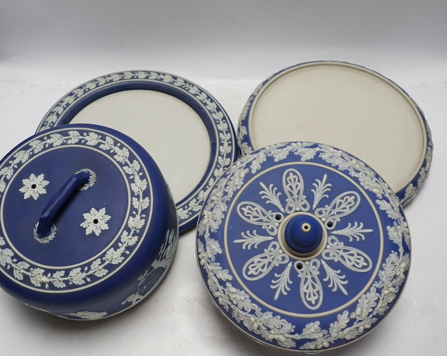 Two Wedgwood blue jasperware cheese dishes and covers, largest 29cm in diameter. Condition - good